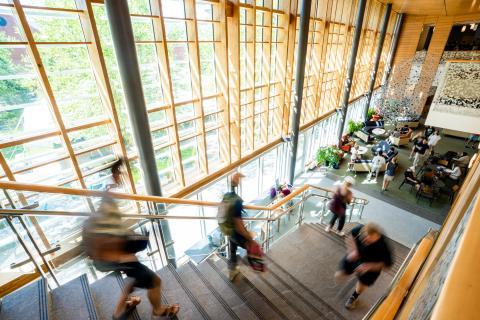 Students walking down a staircase inside the Great Hall 